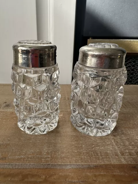 Fostoria American straight sided salt and pepper shakers with glass insert lids