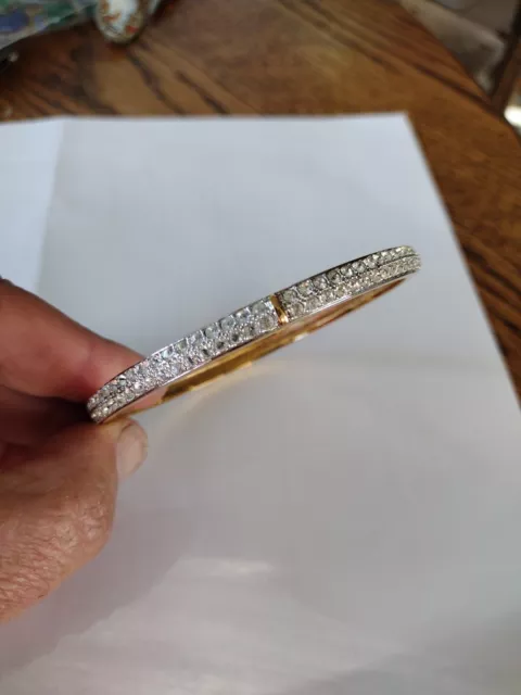 Authentic Swarovski "Swan" Marking Rows Of Crystal Gold Tone bangle bracelet~