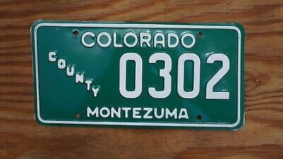 One or More - COLORADO MONTEZUMA COUNTY Vehicle Vintage Green License Plate