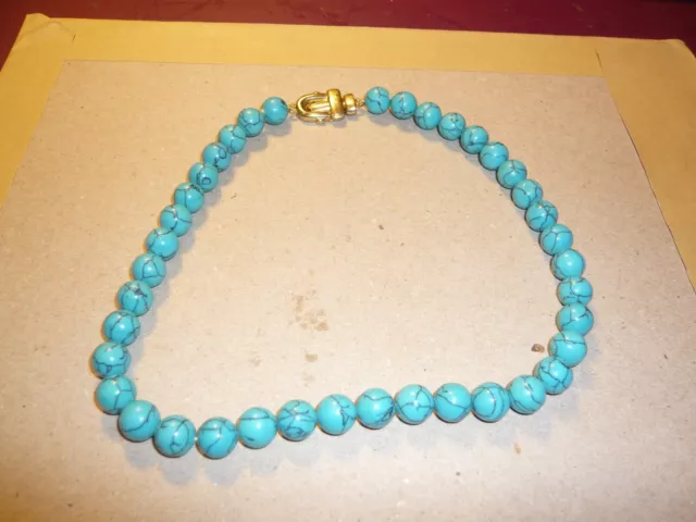 Beaded turquoise necklace with gold plated clip