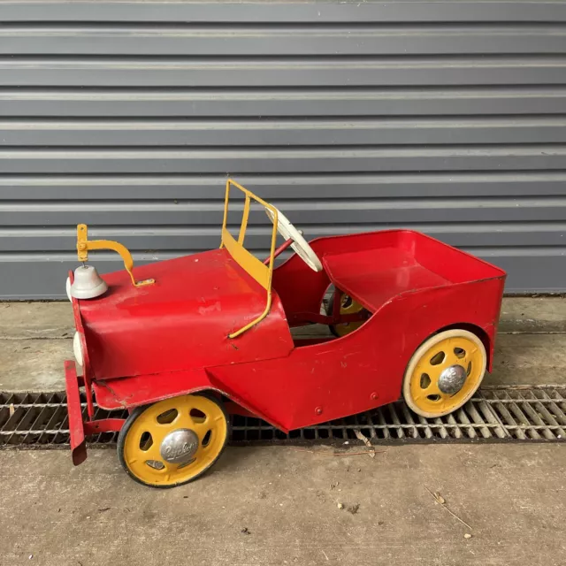 Red and yellow plastic pedal car 2025