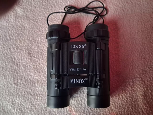 Minox 10x 25. 99m x 100m. mini binoculars. Tinted lenses. Fold down eyepieces.