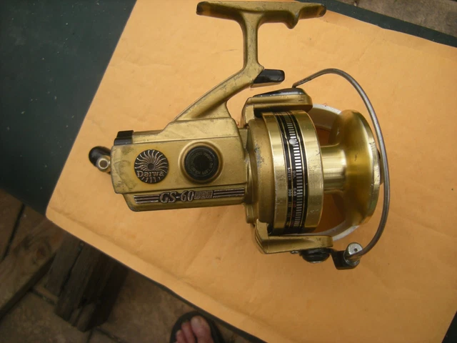 https://www.picclickimg.com/hOIAAOSwsR5khh1I/Vintage-Daiwa-GS-60-Spinning-Reel-Gold.webp