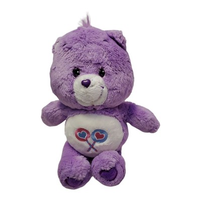 purple care bear with two lollipops