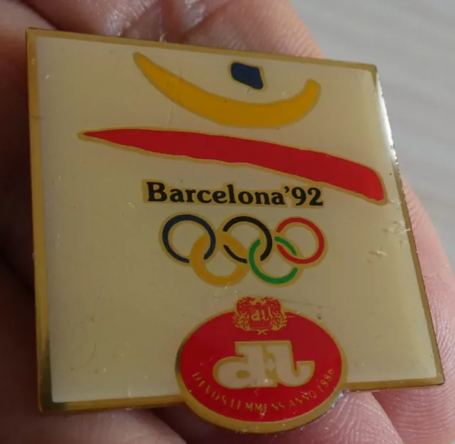 Pin's Sport Jeux Olympiques Barcelone 92 Sponsor Pub Dl Devos Lemmens Anno