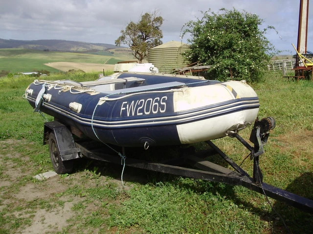 inflatable boat 13.5' on reg trailer. inflatable boat 13.5' on reg trailer.