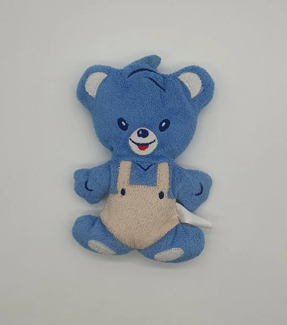 NESTLE - Peluche doudou ours semi plat bleu / blanc / beige grelot 18 cm TTBE