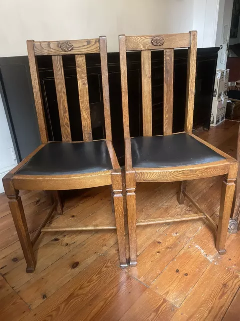 A Pair Of Vintage Oak Dining Chairs