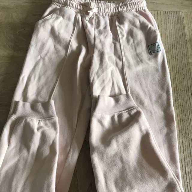 girls H&M pale pink tracksuit bottoms size age 11-12 years