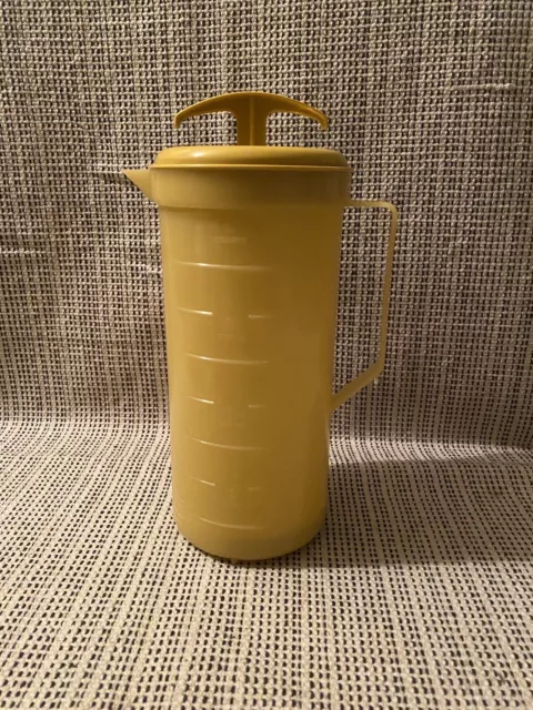 https://www.picclickimg.com/hiwAAOSwQuhlBIHF/Vintage-Federal-Housewares-Gold-Yellow-Plastic-Mixing-Plunger.webp