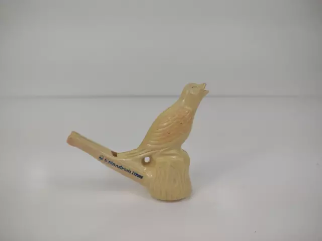 Vintage Celluloid BF Goodrich advertising Bird Whistle sitting on stump USA