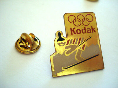 #W5 Jeux Olympiques Anneaux - Pin's Doré KODAK 