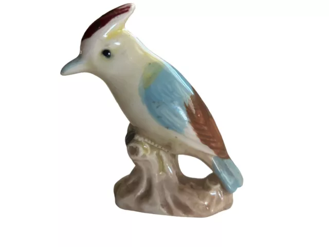 Vintage 1950s Ceramic Crested Bird Figurine blue yellow On Tree Stump 3”