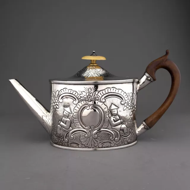 Antique Ornate Chinoiserie Georgian Solid Sterling Silver Teapot. London, 1790.