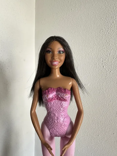 2010’s era purple and pink ballerina barbie (Nikki)