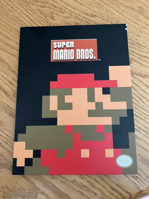 Super Mario Bros. 9 think geek coins (some dupes) with collector book. Nintendo
