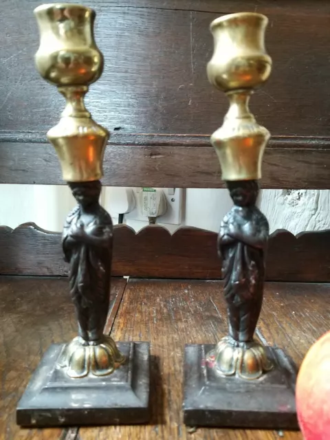 A Rare Regency Pair Of Figural Cast Iron Brass Candlesticks