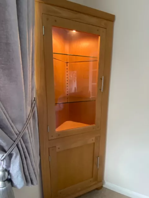 Corner oak glass display cabinet with light. Excellent condition