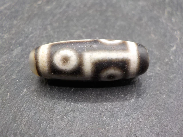 An Agate Dzi bead with a 6 Eye pattern from Tibet / Nepal.
