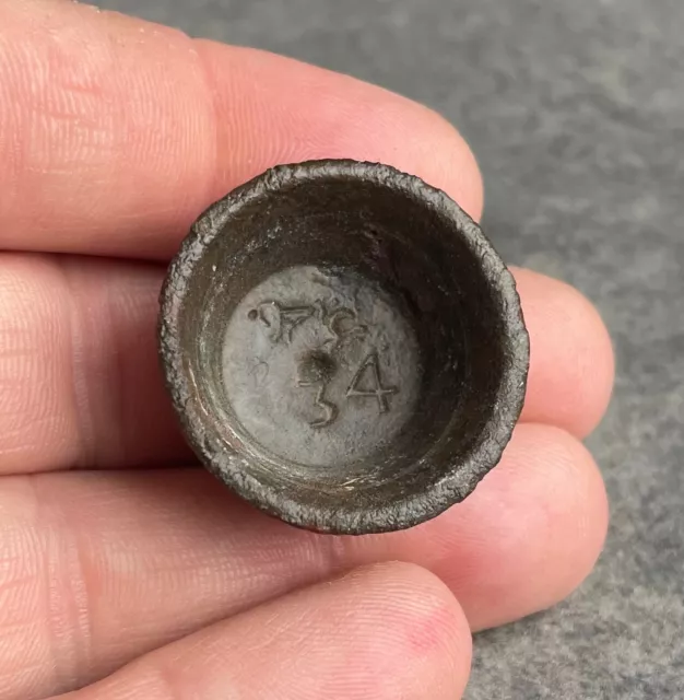 A post medieval copper cup weight with different years stamps  - detecting find