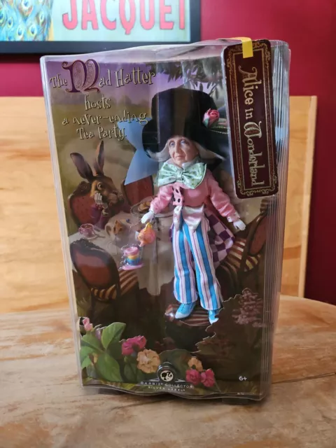 https://www.picclickimg.com/i2IAAOSwiYxk~2G1/Disney-Barbie-Alice-in-Wonderland-MAD-HATTER-Doll.webp