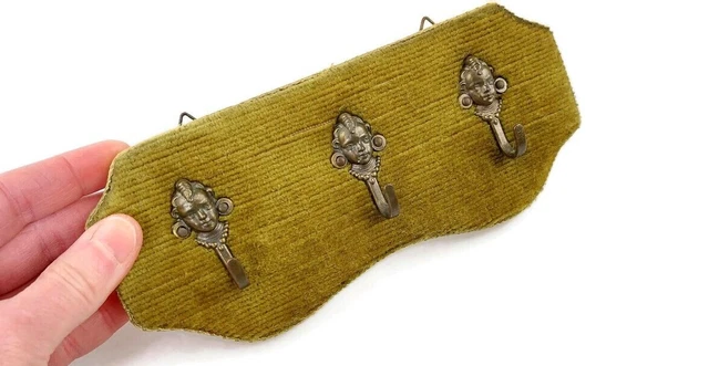 Small vintage brass wall mounted coat hanger in green velvet with cherubs boys