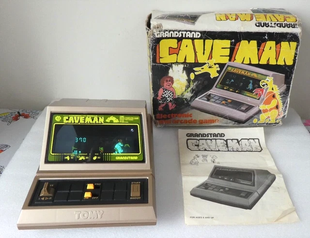 Vieux Jeu Tomy Caveman De 1982 – Console Portable Argentée – état Correct Pour Collection