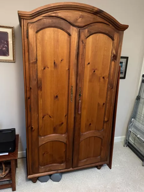 armoire wardrobe used as wardrobe and later as a TV cabinet.