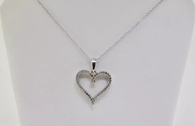 10k White Gold And Diamond Heart Pendant With An 18 inch Chain.