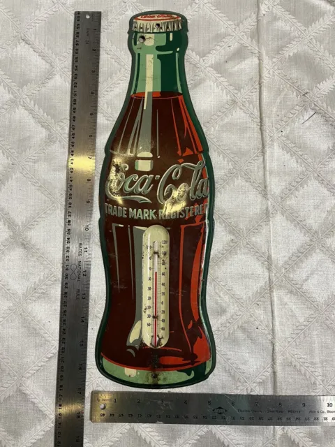 https://www.picclickimg.com/iFgAAOSwUzhljuWf/Vintage-Coca-Cola-Bottle-Shaped-Metal-Advertisement-Sign.webp