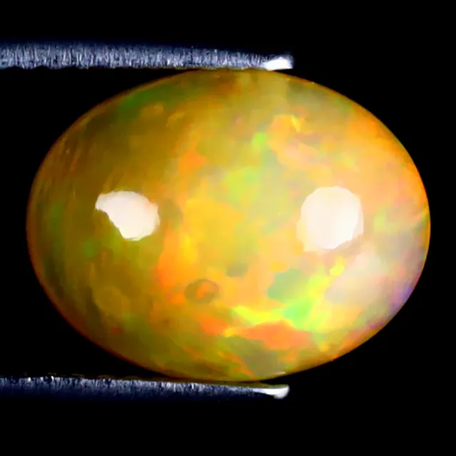 3.12 ct Topnotch Oval Cabochon (12 x 9 mm) Ethiopian Flashing Rainbow Opal