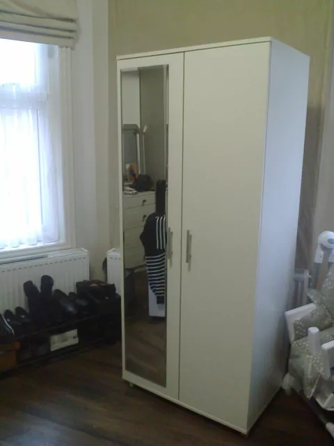 good nice white cupboard for hanging and storing, with mirror on door,