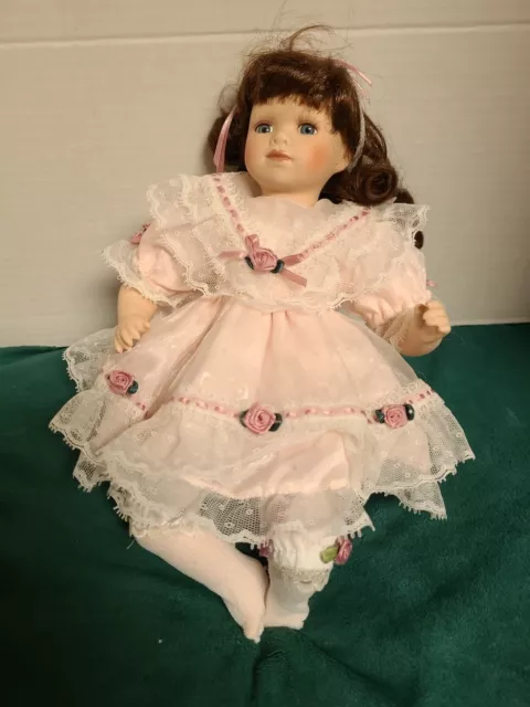 Collections Etc Collectible Sitting porcelain doll  12" tall