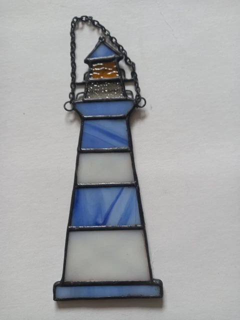 Faro vintage para atrapar el sol en una cadena