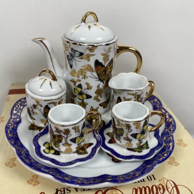 Never used vintage Porcelain Tea set Poinsettia for 6 people