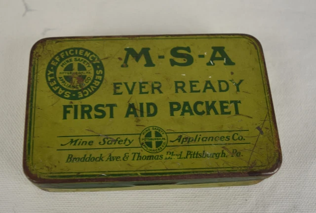 a worn green tin with the logo for MSA, the Mine Safety Association of Pittsburgh Pennsylvania My EDC first aid kit.