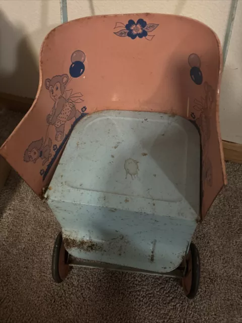 Vintage Pink yellow and blue tin doll stroller from the early 60’s
