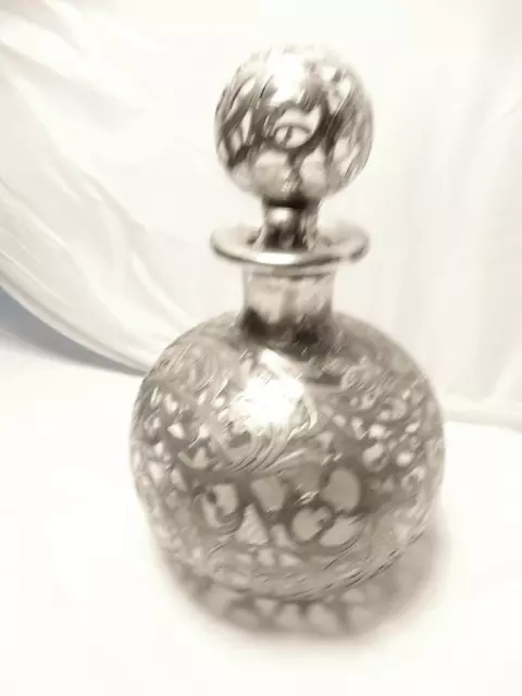 Antique silver overlay liquor decanter 999 silver  8.5 inches tall