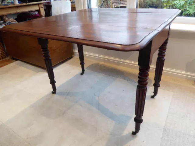 Antique Victorian drop leaf Pembroke table, brass cup casters, drawer, warped