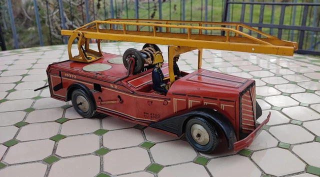 Ancien jouet mécanique à ressort camion pompiers JOUSTRA en tôle