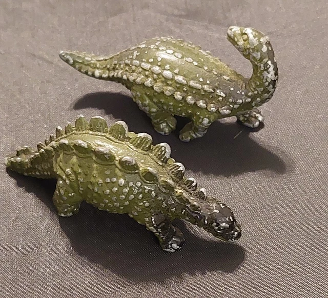 Pair Of Cast Metal Dinosaurs
