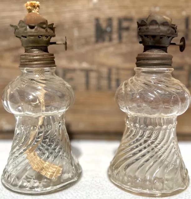 Pair of Small Antique P&A Clear Embossed Swirled Glass Oil Lamps