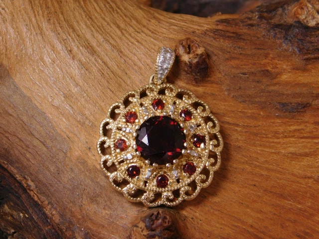 Gold Tone Sterling Silver and Red Faceted Stone Pendant