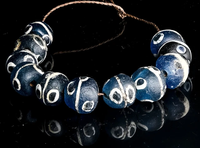 A Short Strand of Ancient Excavated Islamic Period Translucent Blue Glass Evil E