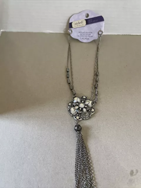 Styled by Tori spelling necklace bottom silver tone ,rhinestones And tassel