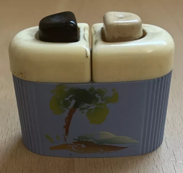https://www.picclickimg.com/ihsAAOSwwFFkK1Ts/Vintage-Carvanite-Push-Button-Salt-and-Pepper-Shaker.webp