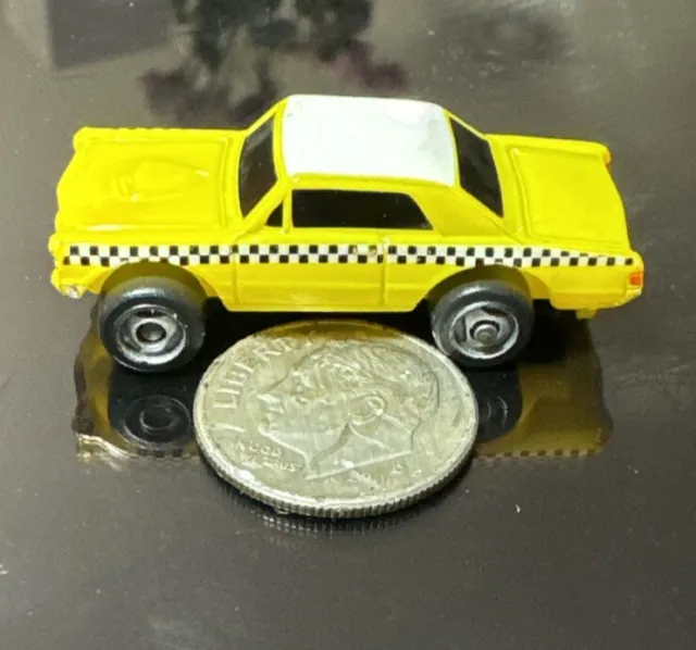 Small Micro Machine 1965 Pontiac GTO in Yellow with Checkerboard Markings (Taxi)