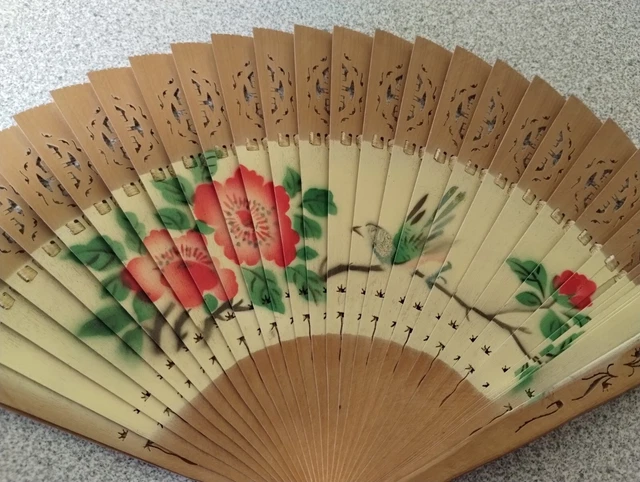 From the Island of Curaca a Wooden Pierced Painted Floral with Bird Fan