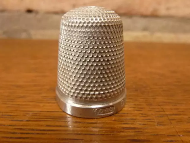 A  small Vintage size 15 Henry Griffith Thimble Sterling silver