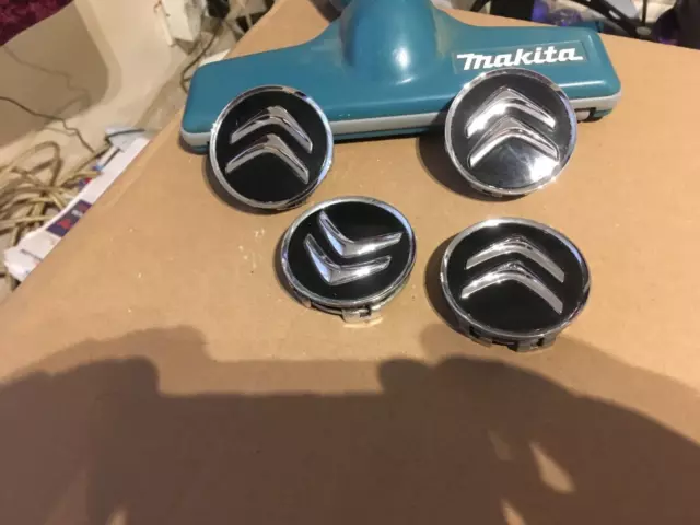 Citreon x4 genuine alloy factory wheel hub centre caps, note chrome backside